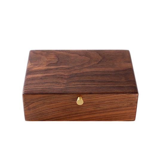 Wooden box with a gold lock on a white background