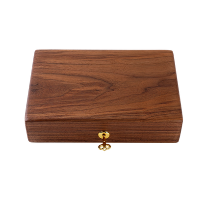 Wooden box with a gold clasp on a white background