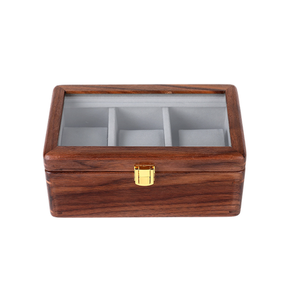 Wooden jewelry box with glass top on a white background