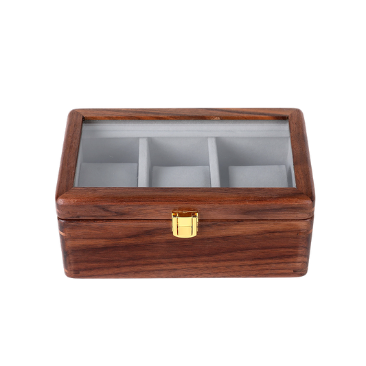 Wooden jewelry box with glass top on a white background