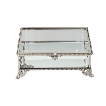 Decorative glass box with silver metal frame on a white background