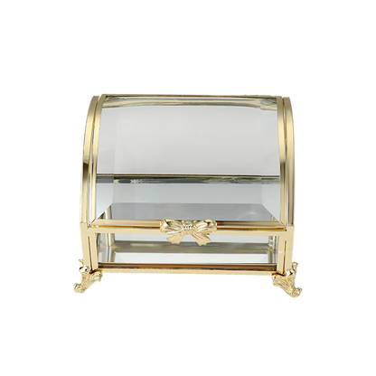 Glass display case with gold accents on a white background