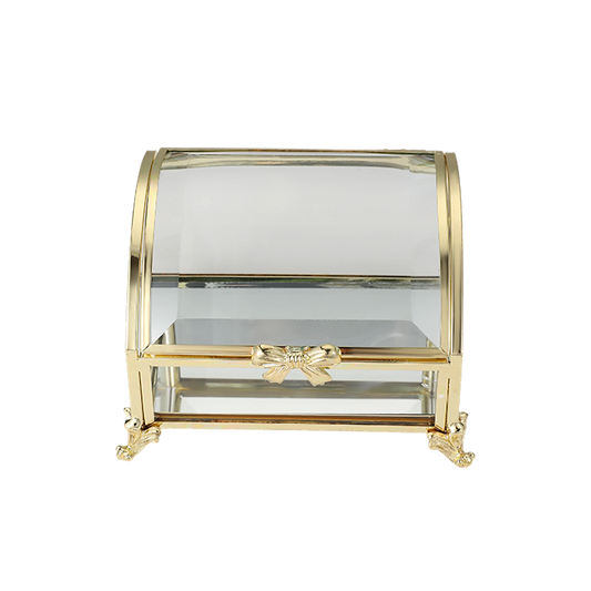 Glass display case with gold accents on a white background