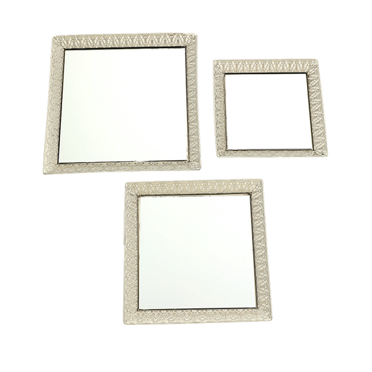 Three square decorative mirrors with ornate frames on a white background