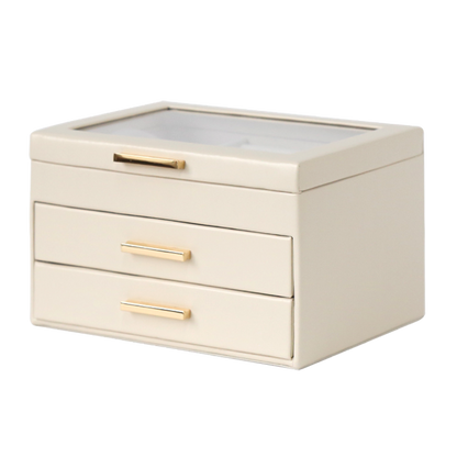 Beige jewelry box with gold handles on a white background
