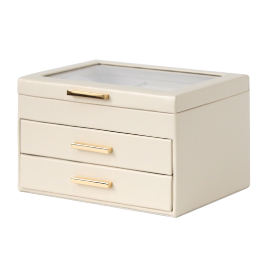 Beige jewelry box with gold handles on a white background