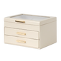 Beige jewelry box with gold handles on a white background