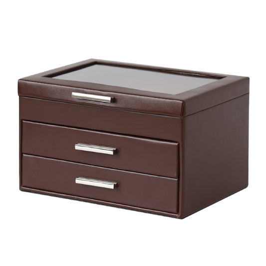 Brown jewelry box with glass top and three drawers on a white background