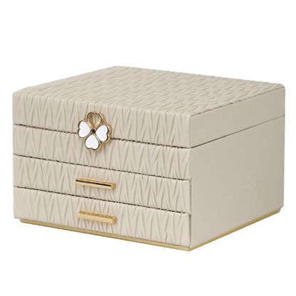 Beige jewelry box with butterfly design on a white background