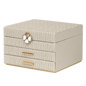 Beige jewelry box with butterfly design on a white background