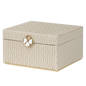 Beige jewelry box with butterfly emblem on a white background