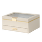 Beige jewelry box with a glass top and gold accents on a white background