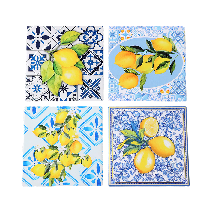 Set of four decorative tiles with lemon designs on a white background