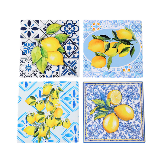 Set of four decorative tiles with lemon designs on a white background