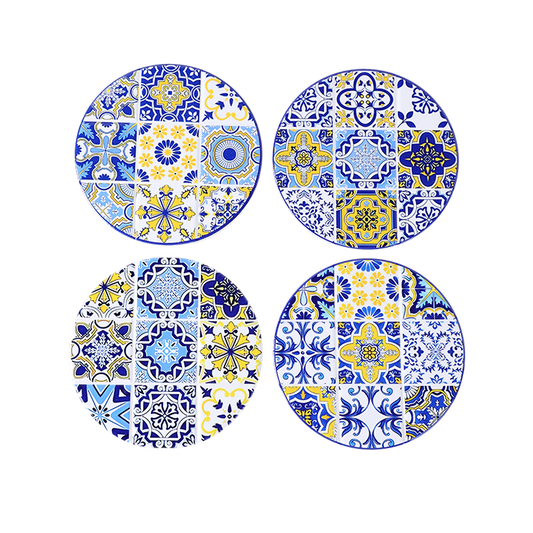 Set of four round ceramic plates with blue and yellow geometric patterns on a white background