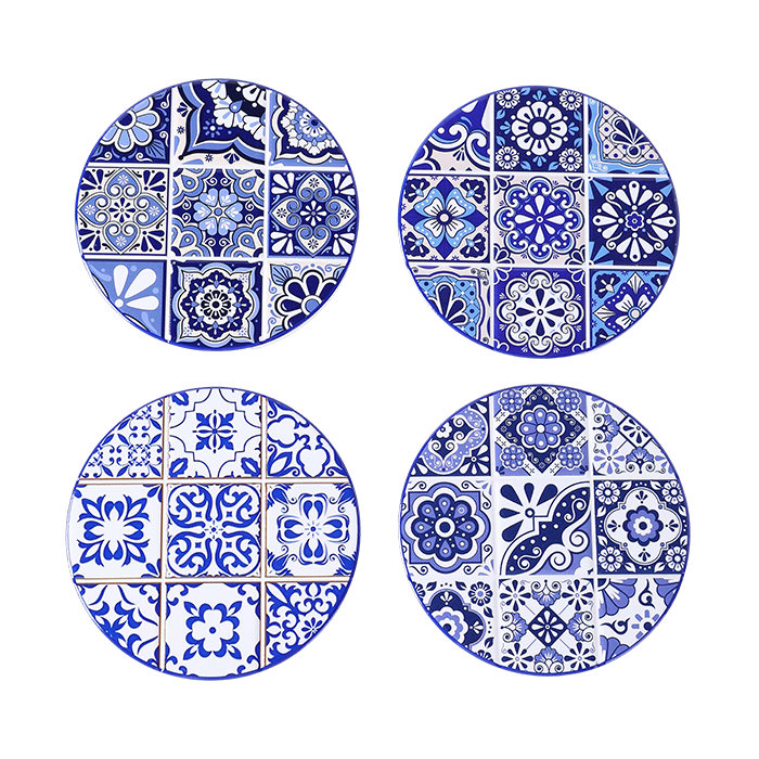 Four blue and white patterned coasters on a white background