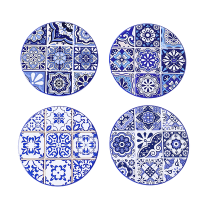 Four blue and white patterned coasters on a white background