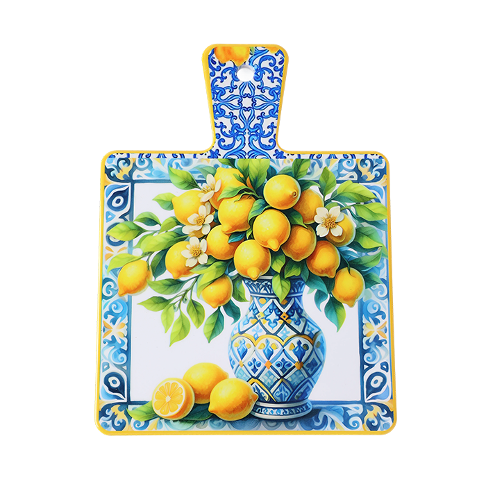 Decorative cutting board with a floral and lemon design on a white background