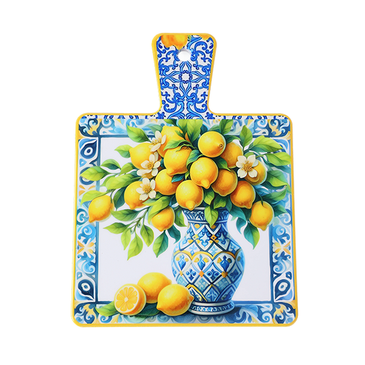 Decorative cutting board with a floral and lemon design on a white background