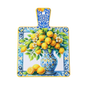 Decorative cutting board with a floral and lemon design on a white background