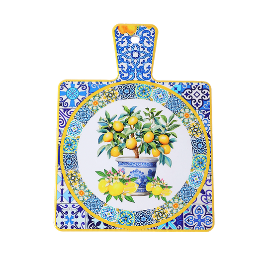 Decorative cutting board with lemon tree design and blue patterned border on a white background