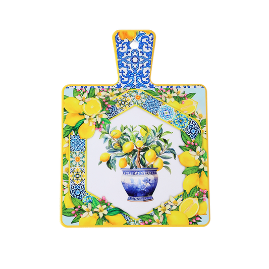 Decorative cutting board with lemon design and floral patterns on a white background