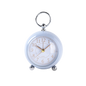 Small round clock with a keychain on a white background