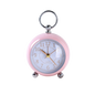 Pink pocket watch with a white face on a white background